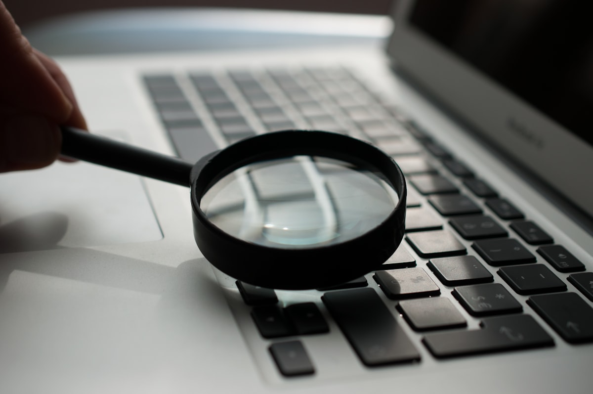 A magnifying glass resting on printed text